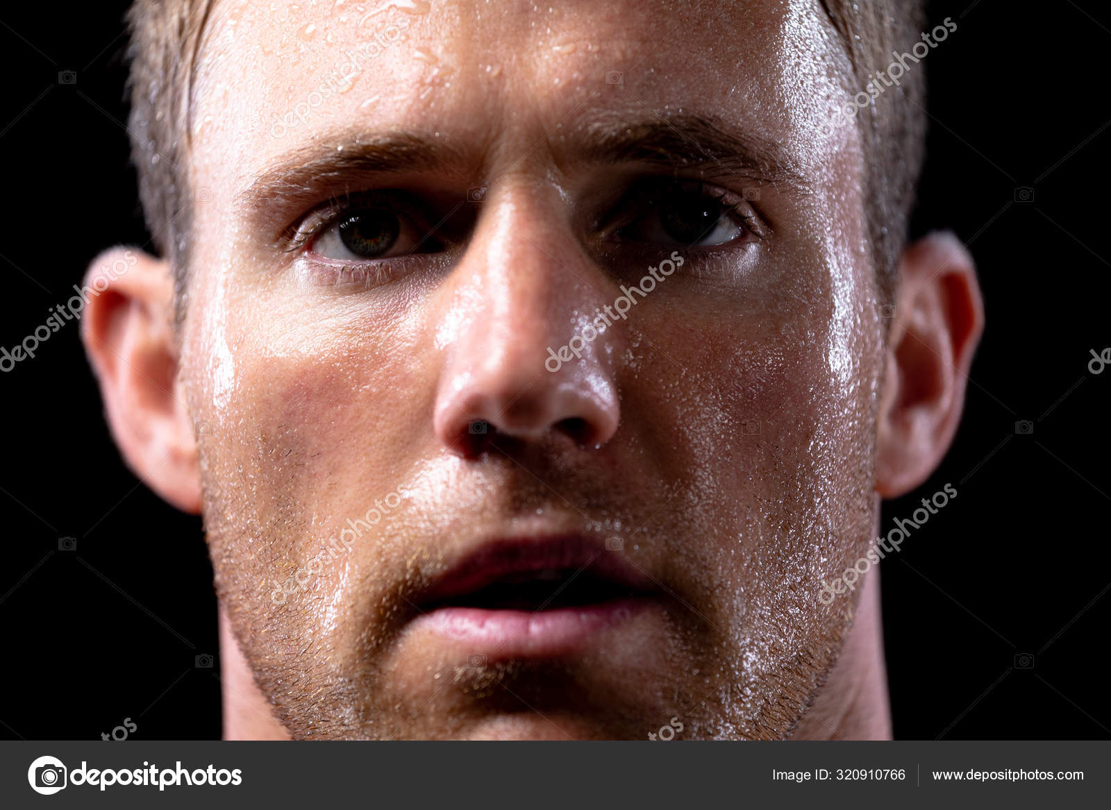 Head Shot Caucasian Male Athlete Sweating Work Out Looking Straight Stock Photo by