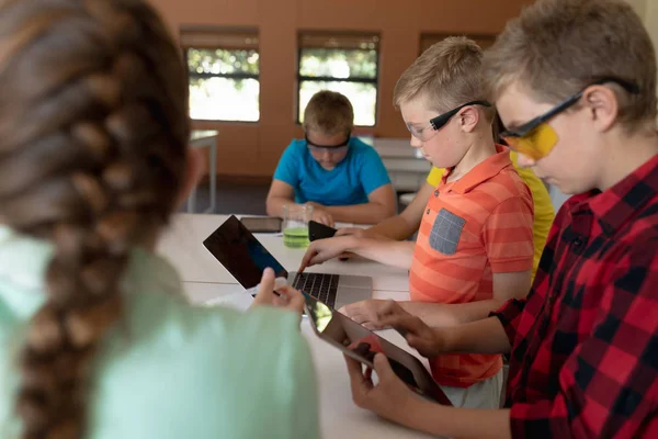 Side View Two Caucasian Schoolboys Sitting Desk Wearing Safety Glasses — Stock Photo, Image