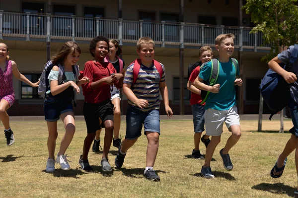 Front View Diverse Group Schoolchildren Wearing Shorts Rucksacks Running Playing — 스톡 사진