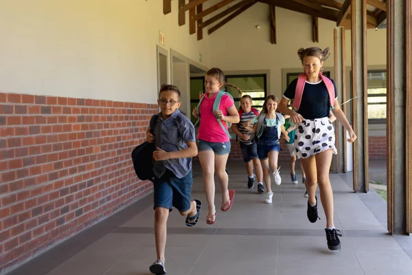 Front View Diverse Group Schoolchildren Wearing Shorts Skirts Rucksacks Running — 스톡 사진