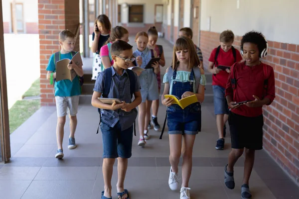 Front View Diverse Group School Pupils Wearing Rucksacks Carrying Books — Stock Photo, Image