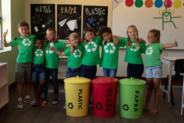 Portrait Diverse Group Schoolchildren Wearing Green Shirts White Recycling Logo — Stock Photo, Image