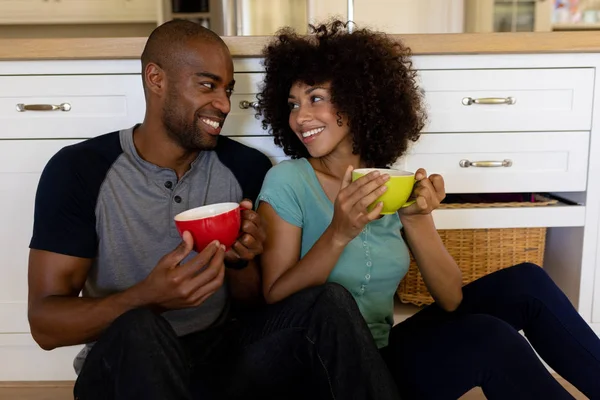 Front View Close Mixed Race Couple Sitting Floor Kitchen Holding — Stock Photo, Image