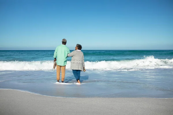 Rear View Senior African American Couple Paddling Shallow Water Blue — Stock Photo, Image