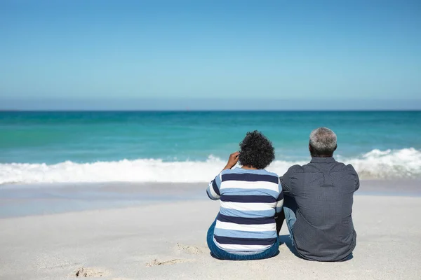 Rear View Senior African American Couple Sitting Beach Blue Sky — 스톡 사진