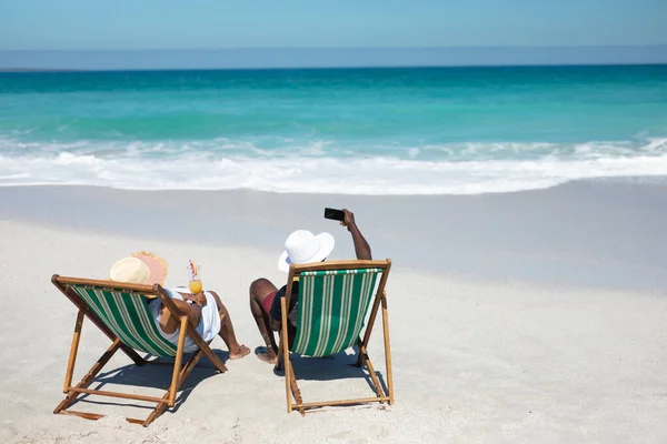 Elevated Rear View Senior African American Couple Beach Sun Sitting — Stock Photo, Image