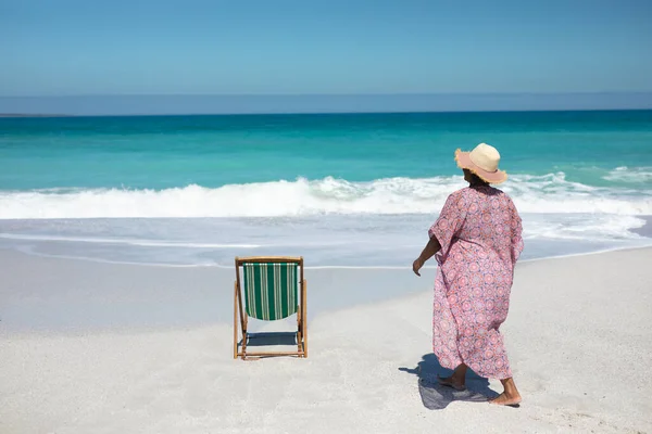 Rear View Senior African American Woman Beach Walking Deckchair Facing — 스톡 사진