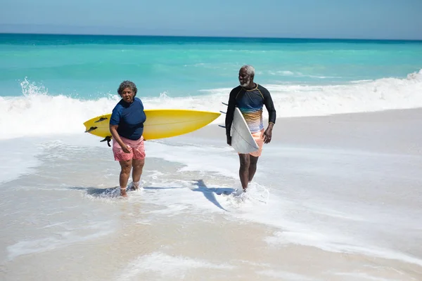 Front View Senior African American Couple Beach Sun Carrying Surfboards — 스톡 사진