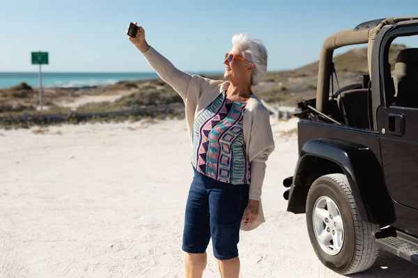 Side View Senior Caucasian Woman Beach Sun Wearing Sunglasses Standing — Stock Photo, Image