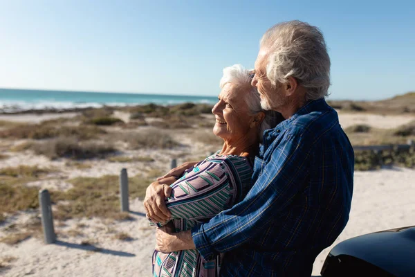 Side View Close Senior Caucasian Couple Beach Sun Standing Embracing — 스톡 사진