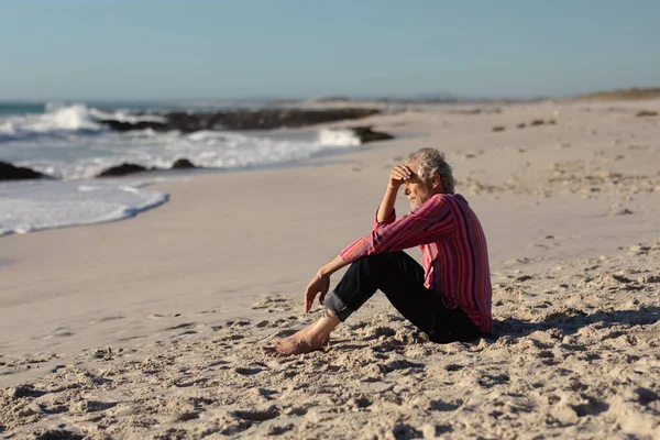 Side View Senior Caucasian Man Beach Sun Sitting Sand Shielding — Stock Photo, Image