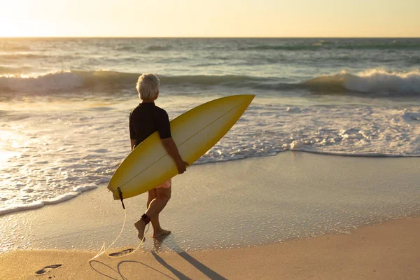 Side View Senior Caucasian Woman Beach Sunset Walking Sand Carrying — 스톡 사진