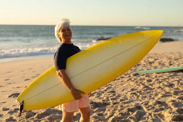 Side View Senior Caucasian Woman Beach Sunset Standing Sand Holding — 스톡 사진