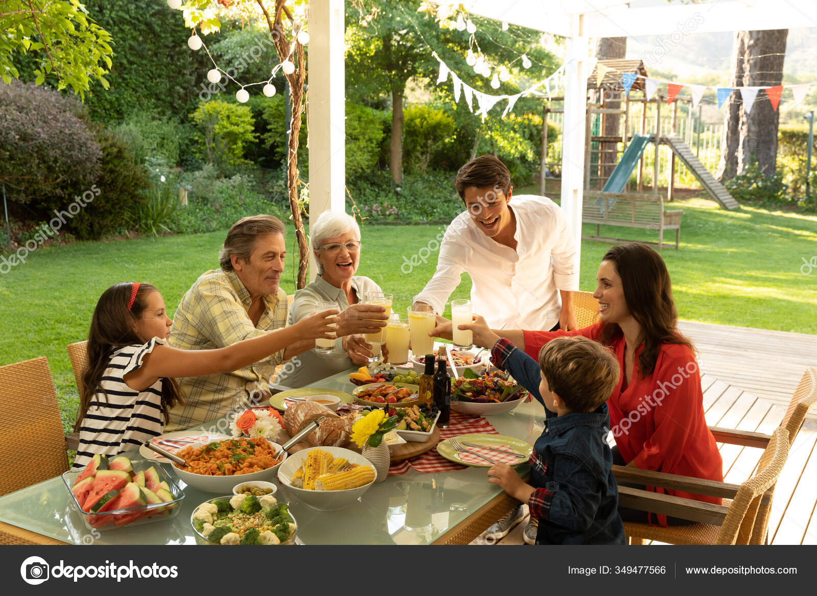 Side View Multi Generation Caucasian Family Sitting Dinner Table