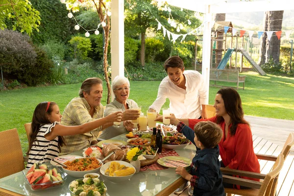 Side View Multi Generation Caucasian Family Sitting Dinner Table Set — Stock Photo, Image