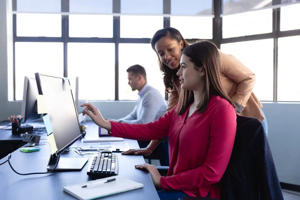 Side View Two Women Working Modern Office Gathering Desk Looking — Stock Photo, Image