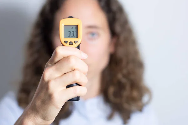 Portrait Caucasian Woman Long Curly Hair Examining Her Temperature Holding — Stock Photo, Image