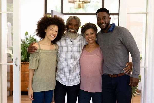 Mixed Race Family Enjoying Time Home Together Standing Hallway Embracing — Stock Photo, Image