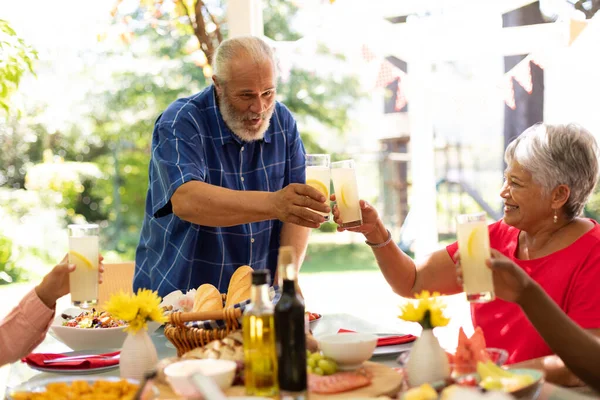 Front View Mixed Race Senior Man Standing Raising Glass Lemonade — Stock Photo, Image