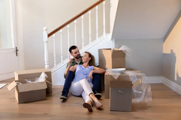 Front View Caucasian Couple Sitting Floor Hallway New Home Taking — Stock Photo, Image