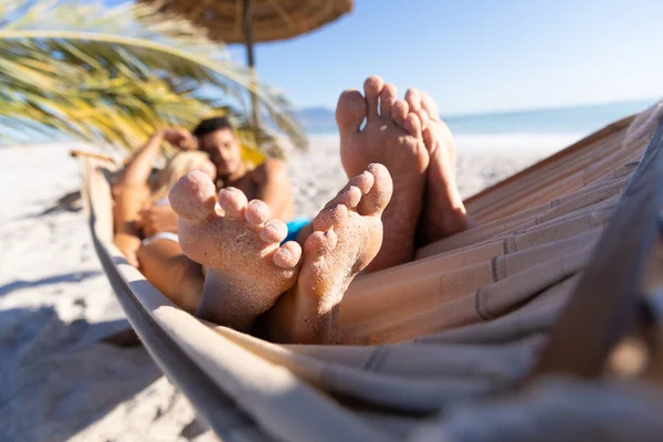 Caucasian Couple Enjoying Time Beach Lying Hammock Embracing Holding Hands — Stock Photo, Image