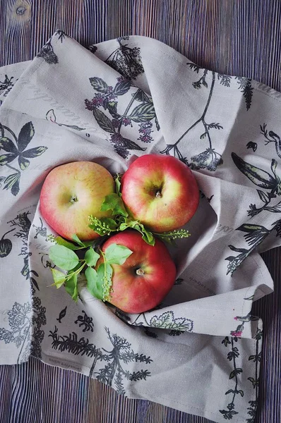 Fresh red apples on cotton towels