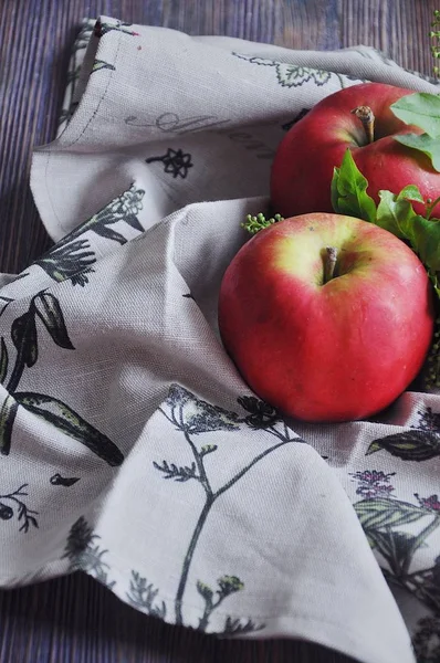 Fresh red apples on cotton towels