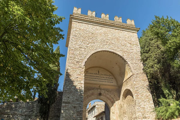 Assisi arch entrance Porta Nuova during sunny day. Royalty Free Stock Images