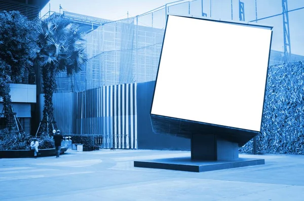 cube shaped blank showcase billboard or advertising light box for your text message or media content at open air shopping center, advertisement, commercial and marketing concept, blue color tone