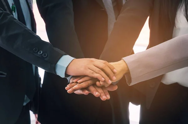 group of business people team joining hands together in office, successful, support, meeting, partner, teamwork, community, connection concept, vintage color tone, selective focus