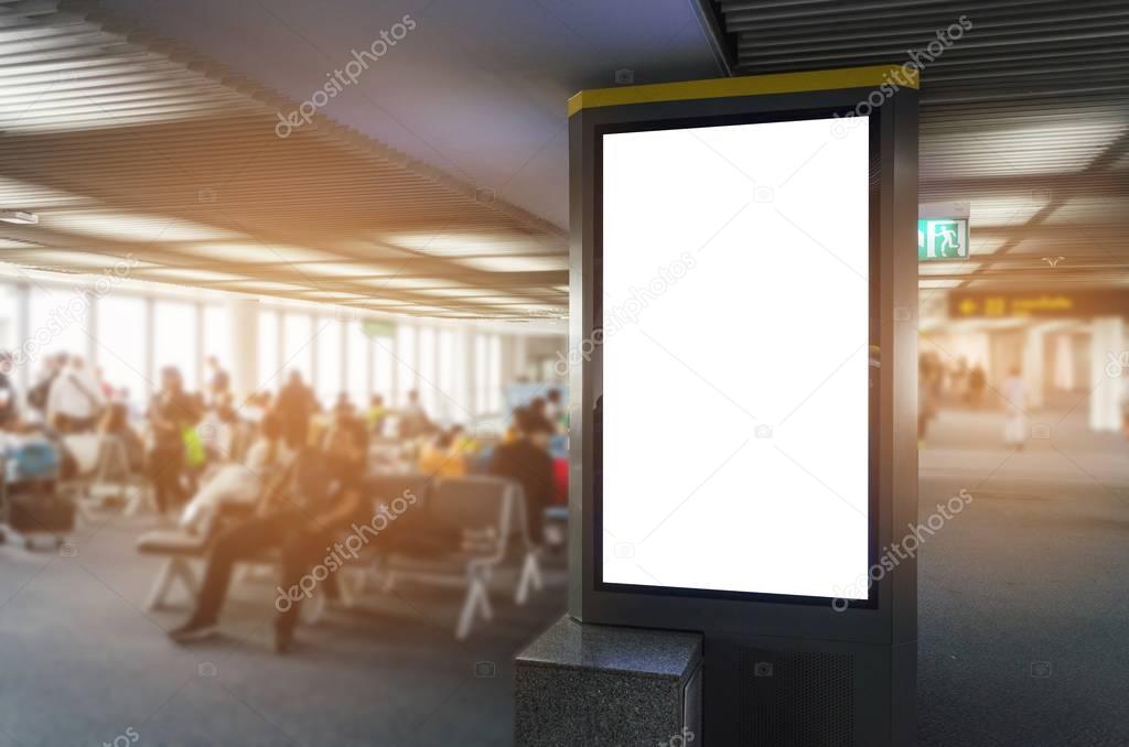 mock up of vertical blank advertising billboard or light box showcase with people waiting at airport, copy space for your text message or media content, advertisement, commercial and marketing concept