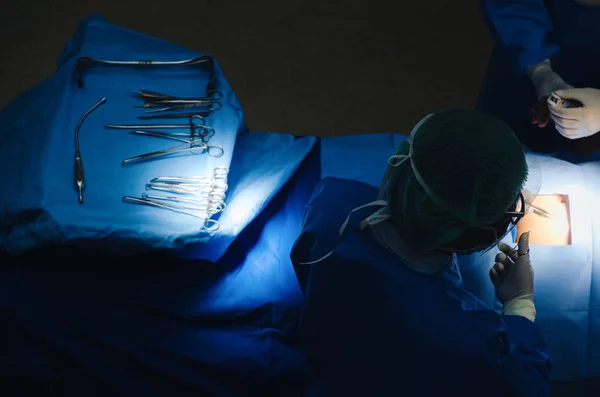 top view of group of Doctor and Assistant surgeons work for rescue patient in operation room at hospital, emergency case, surgery, medical technology, health care cancer and disease treatment concept