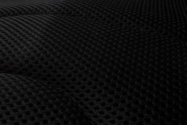 texture of black mesh fabric used in the upholstery of chairs and bags