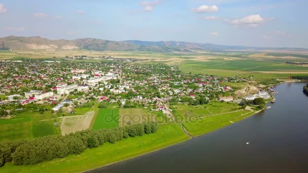 Aerial view of a small town in the Balkans and river Danube — Stock Video