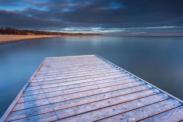 Early morning at frozen small pier in Sopot. — Stock Photo, Image