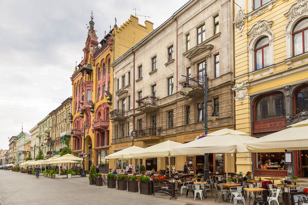 Lodz, Poland- July 15, 2017: Piotrkowska Street. Main shopping street and representative, shopping and entertainment promenade. Tourists and inhabitants on the street.