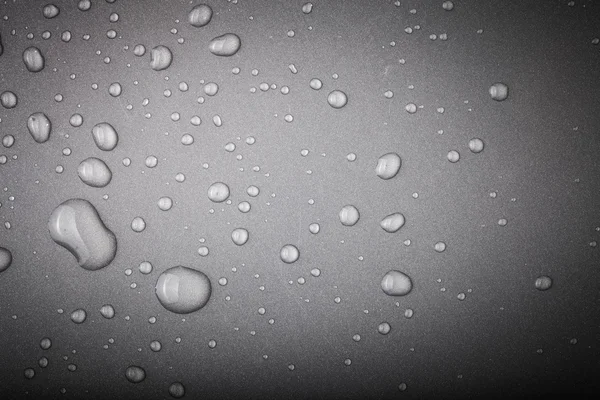 Gotas de água em um fundo a cores. Cinza. Tonificado — Fotografia de Stock