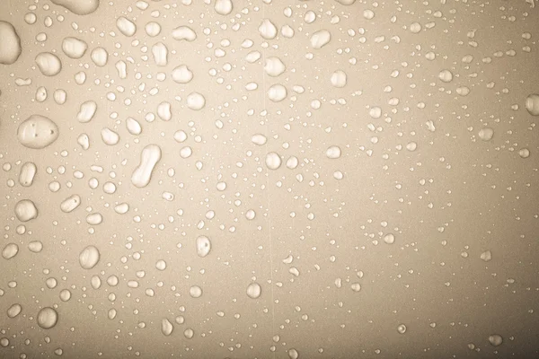 Wassertropfen auf einem farbigen Hintergrund. Grau. gemildert — Stockfoto