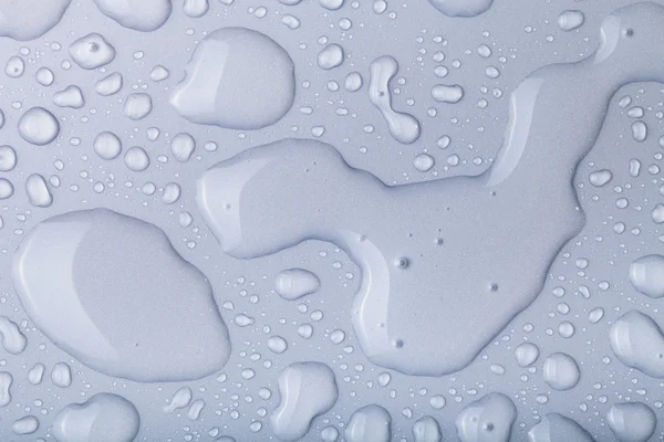 Wassertropfen auf einem farbigen Hintergrund. grau — Stockfoto