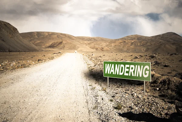 Pointer on mountain road in Tajikistan. Pamir highway. Toned — Stock Photo, Image