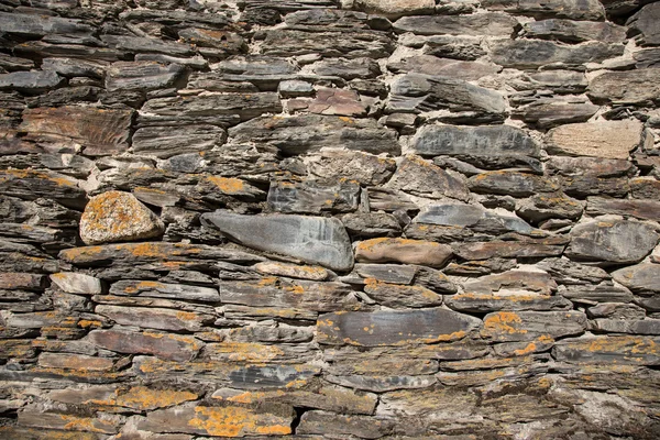 Detail of a wall of an ancient stone house — Stock Photo, Image