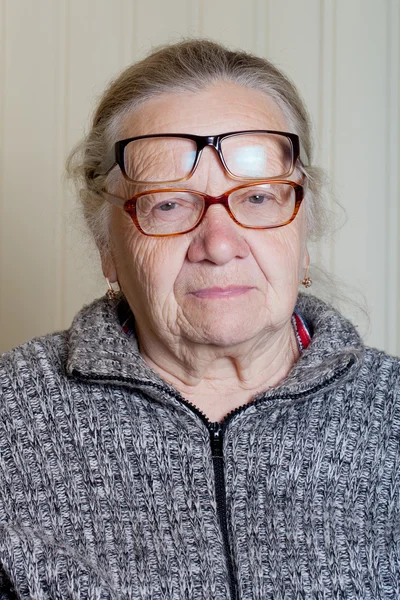 Portrait of elderly woman with glasses — Stock Photo, Image
