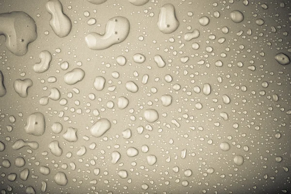 Drops of water on a color background. Toned — Stock Photo, Image