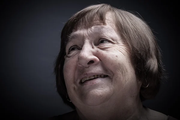 Portrait of elderly woman. Smile. Toned — Stock Photo, Image