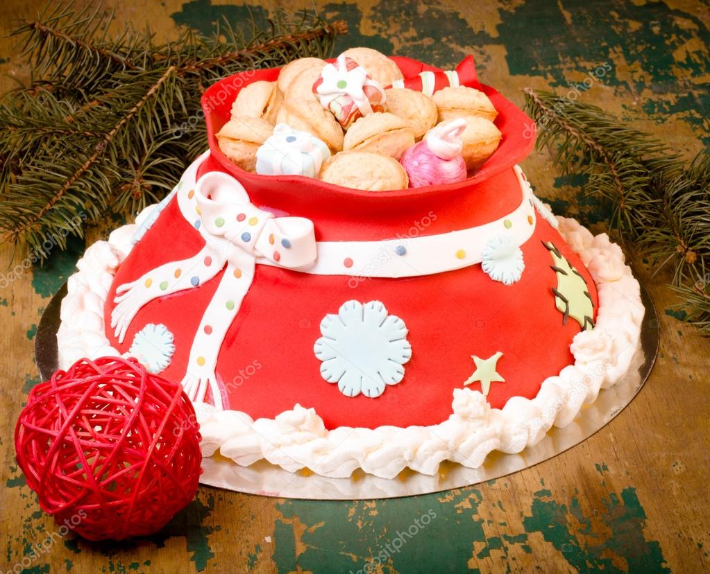 Cake in the form of a bag with gifts from Santa Claus. Christmas