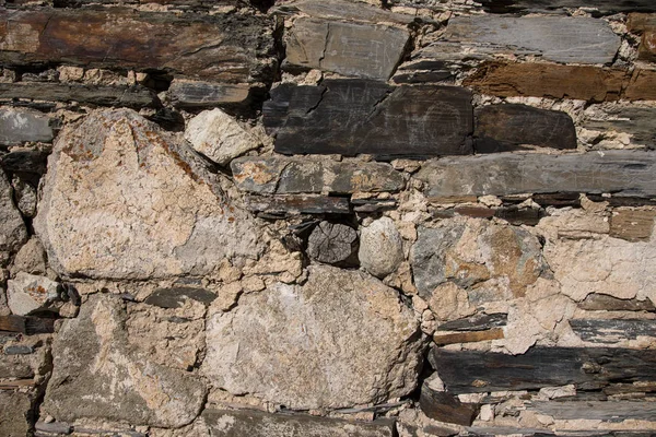 Detalj av en vägg av en gamla stenhus — Stockfoto