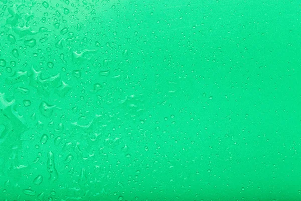 Gotas de água em um fundo a cores. Verde. Foco seletivo. Sh... — Fotografia de Stock