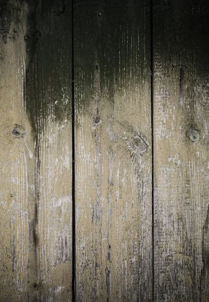 Alte Holzbohlen mit abblätternder Farbe als Hintergrund. gemildert — Stockfoto