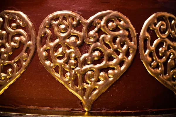 Fragment of chocolate homemade cake with golden decor. Toned — Stock Photo, Image
