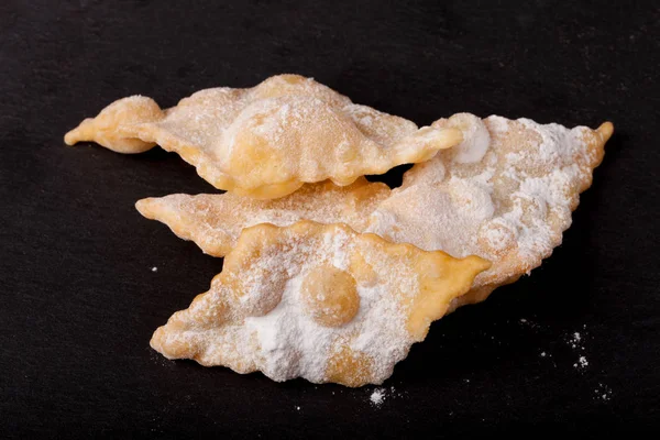 Homemade cookies fried deep-fried and sprinkled with powdered su — Stock Photo, Image